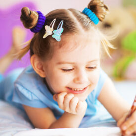 Happy cute girl painting in her room