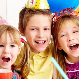 Group of adorable kids having fun at birthday party